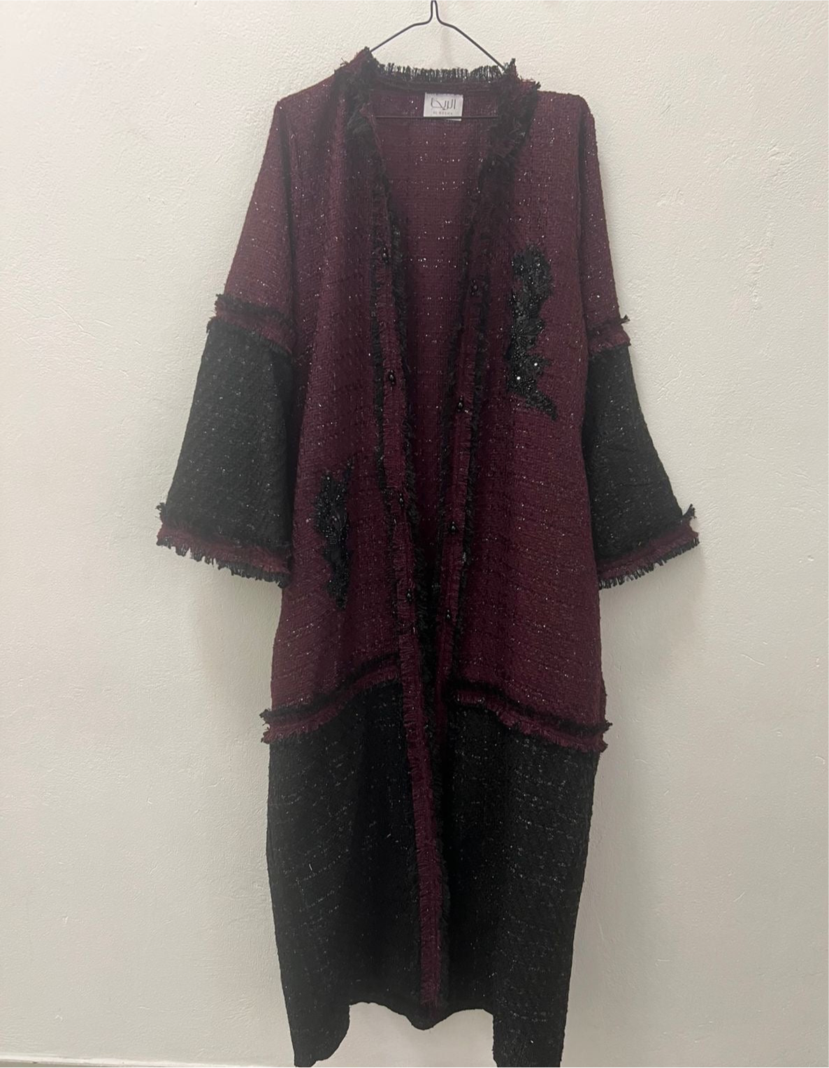 Black and maroon frayed tweed coat with motif details