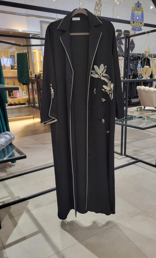 Detailed feather and flower abaya