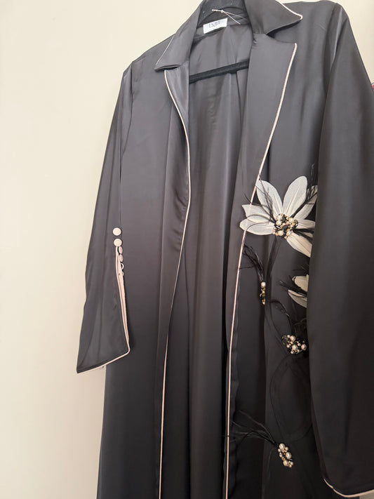 Detailed feather and flower abaya